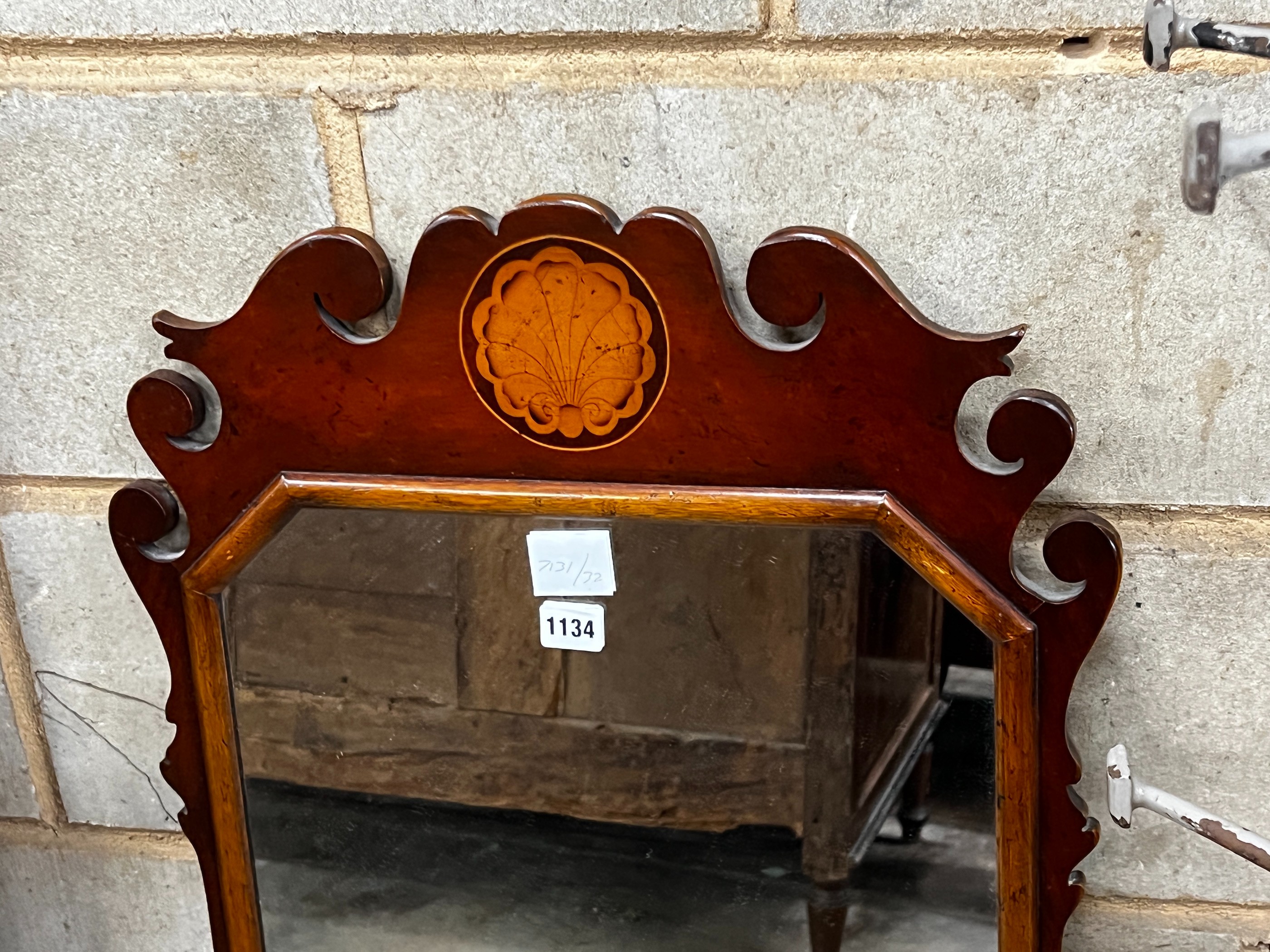 A George III style mahogany fret cut wall mirror, width 52cm, height 90cm